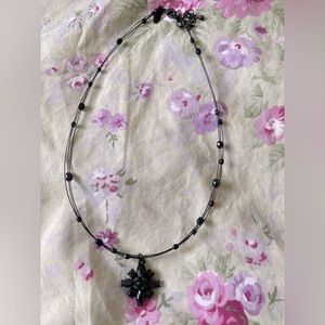 Black necklace with layers and beaded pendant